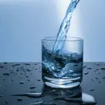 water being poured into a drinking glass