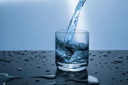 water being poured into a drinking glass
