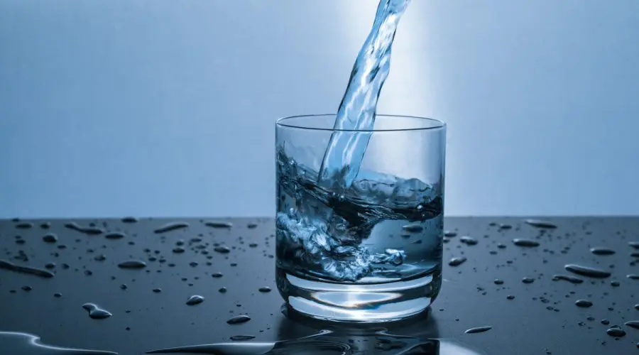 water being poured into a drinking glass